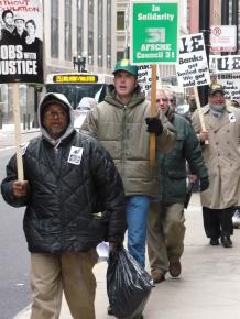 Supporters of Republic WIndows and Doors workers picket outside of Bank of America