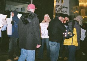 Demonstrators send a message to a Boston real estate owner