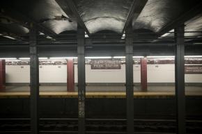 Weekend service cuts leave a New York City subway station empty