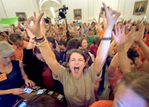 Protesters pack the Texas Capitol building to obstruct a vote on an anti-abortion bill