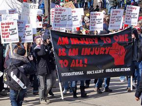 A contingent organized by the International Socialist Organization marching against union-busting in Madison