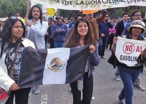 Women workers lead a demonstration against gas price hikes in Mexico City